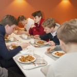 Finland is the first country in the world, which started to serve free school meals. The English School of Helsinki students having lunch in school cafeteria.